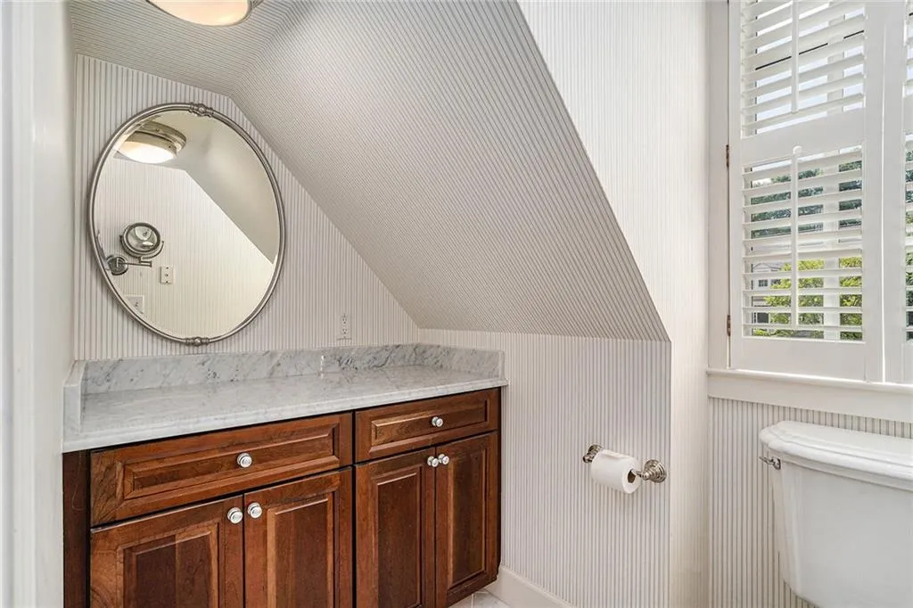 Water closet in owners' suite with vanity