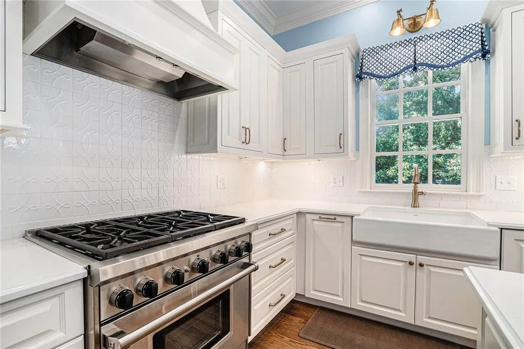 Wolf gas range and farmhouse sink