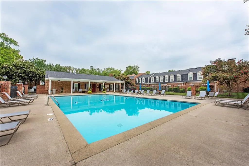 Community pool featuring a patio