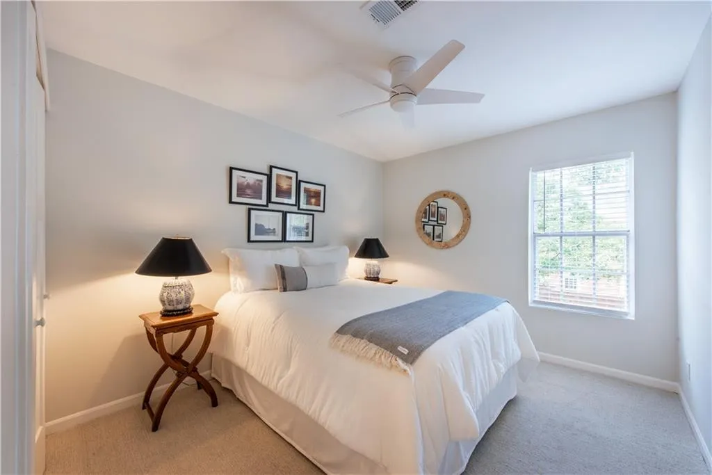 Bedroom with carpet and a ceiling fan