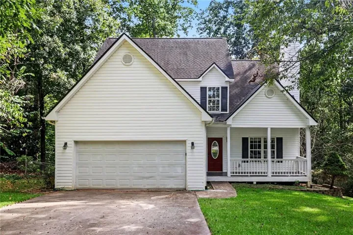 White siding exterior with a dark shingle roof