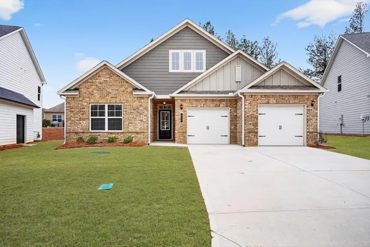 Brick and siding exterior with gabled roof lines