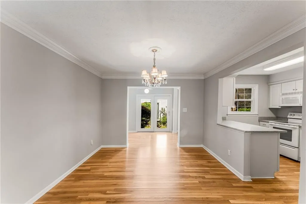 View through Dining area & Kitchen to Sun Room.
