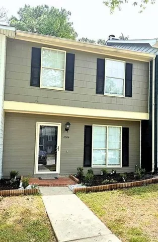 Two-story exterior with horizontal siding and contrasting trim