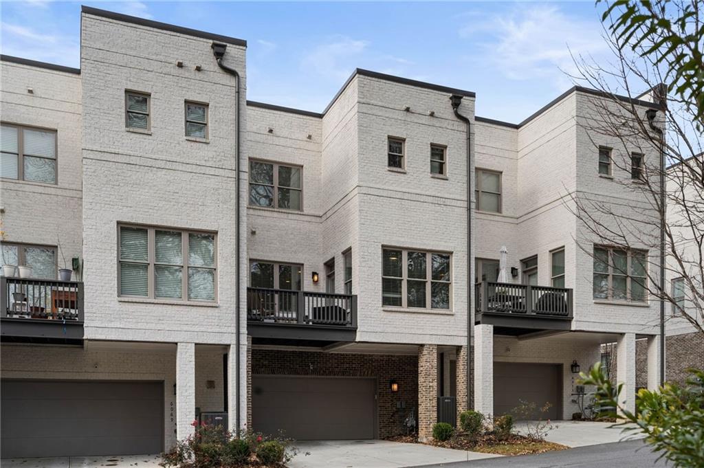 View of property featuring a garage