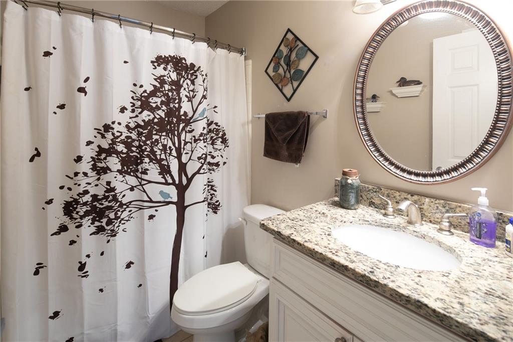 Bathroom with oversized vanity and toilet