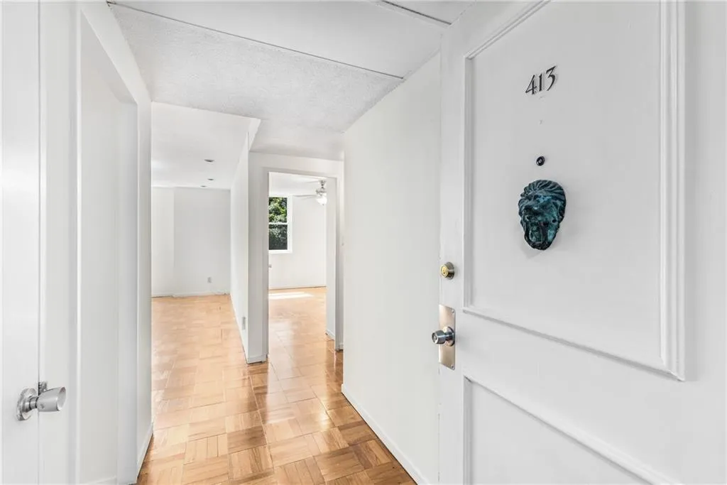 Gleaming parquet flooring stretches throughout the home