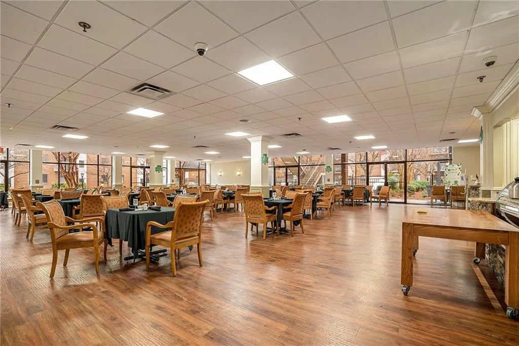 There are so many amenities included! For example, the dining area, which includes a $138 monthly meal credit. Other amenities are interspersed with the other photos of the unit.