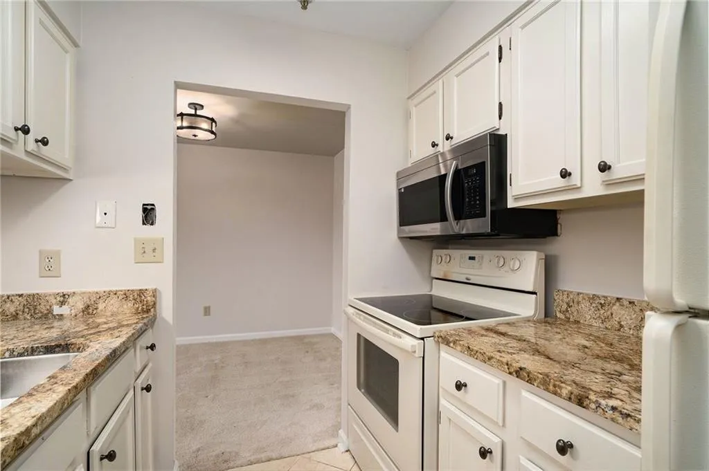 The kitchen was recently painted.