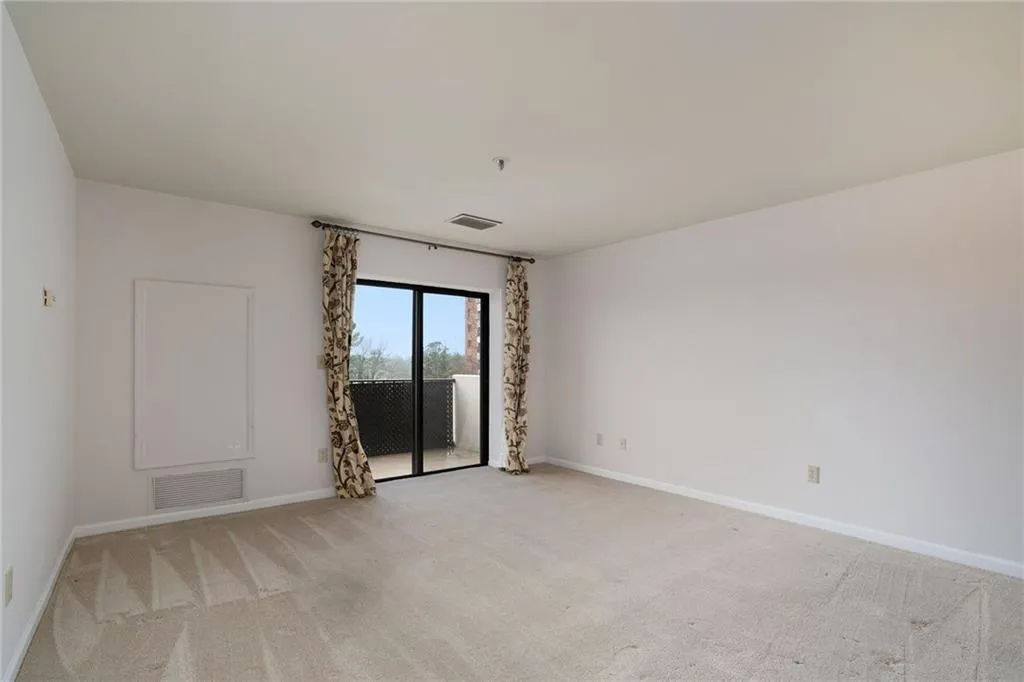 The main living area with freshly painted walls and trim.