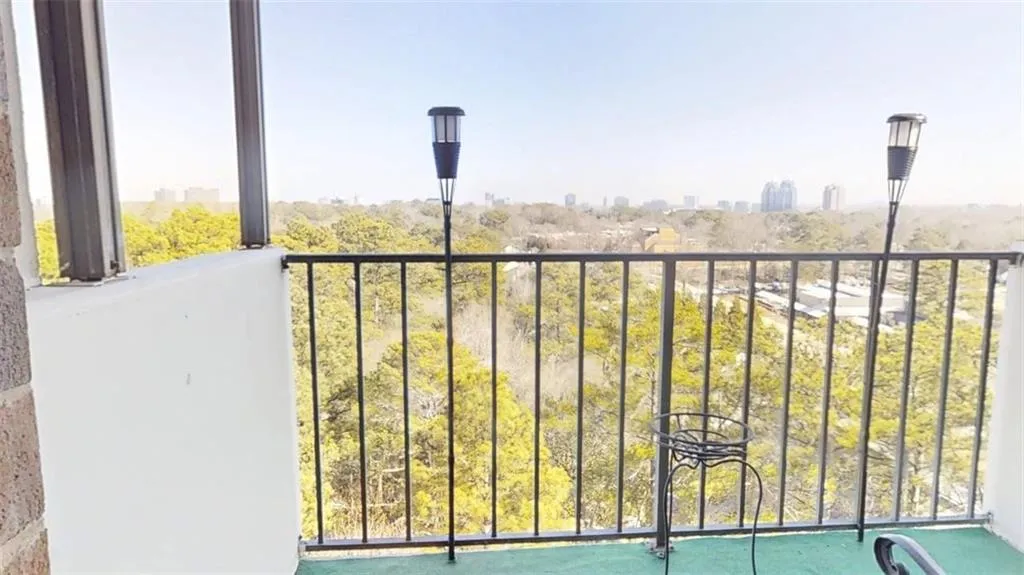 Balcony featuring a skyline view