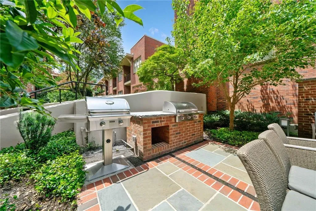 View of patio featuring exterior kitchen and area for grilling