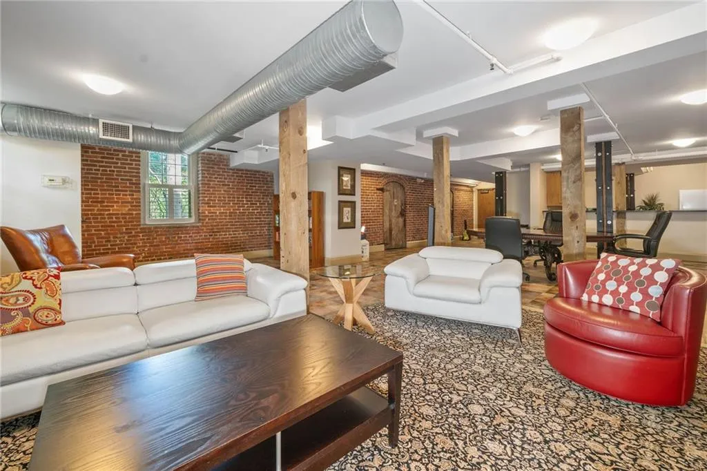 Common area with brick wall