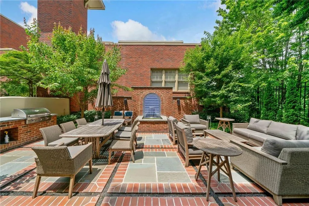 View of patio featuring an outdoor living space, exterior kitchen, grilling area, and outdoor dining space
