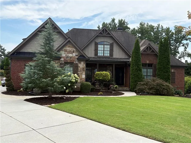 Brick and stone exterior with decorative gables