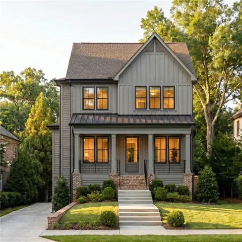 Two-story residence featuring a gabled roofline and board and batten siding