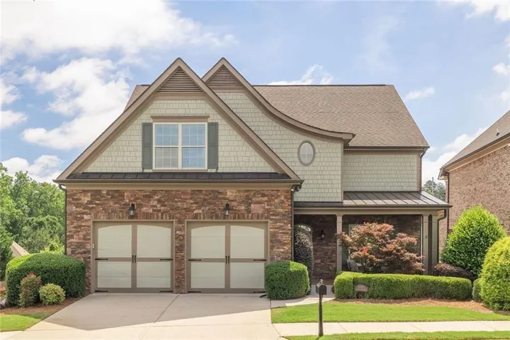 Welcome home to this beautiful Craftsman style home in award winning Active Adult 55+ community in Johns Creek. Freshly painted exterior