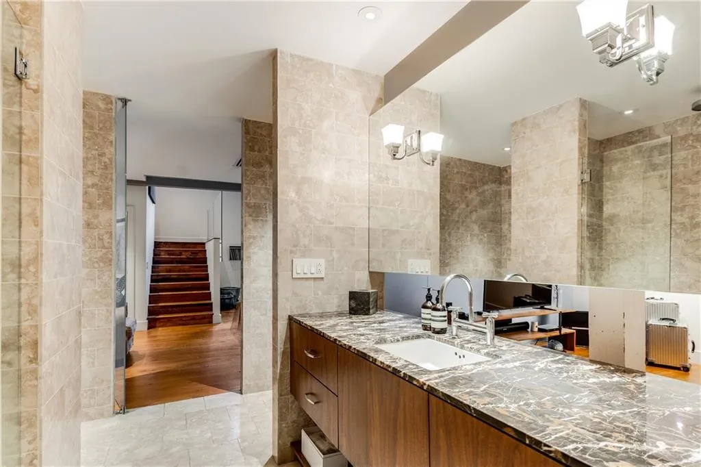 Full bathroom featuring tile walls, vanity, light tile patterned floors, and recessed lighting