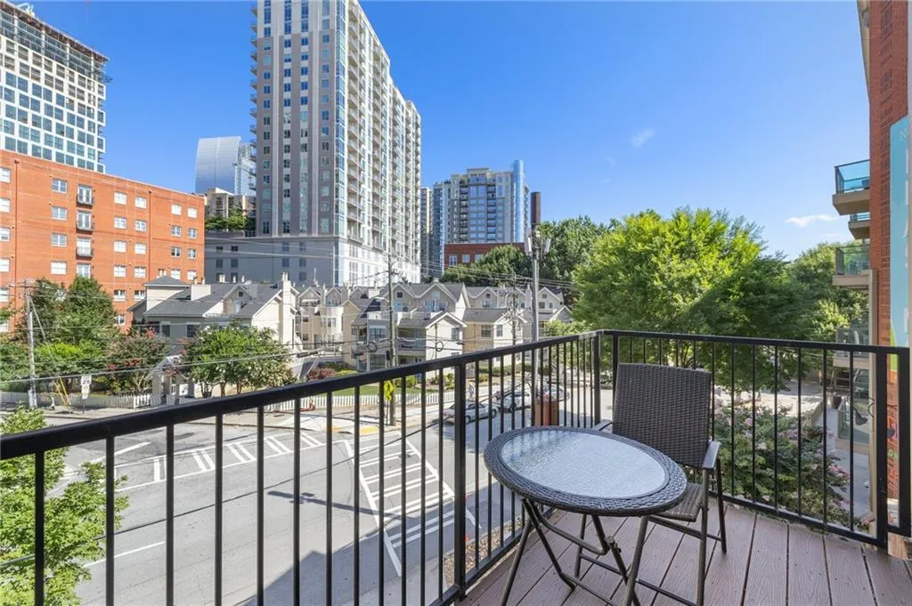 Balcony featuring a view of city