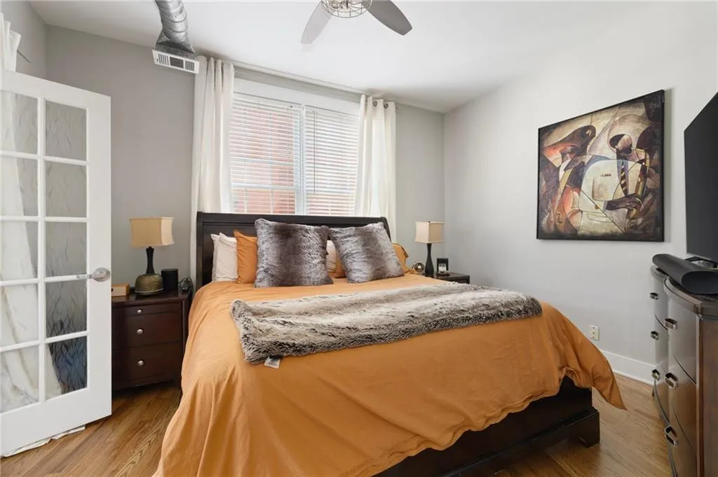 Bedroom featuring wood finished floors and a ceiling fan