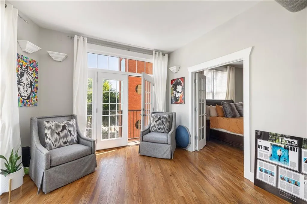 Living area with french doors and wood finished floors