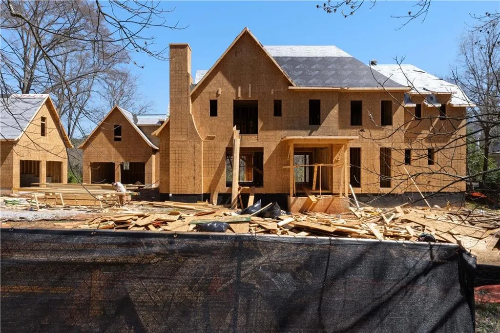 View of front of home featuring a chimney