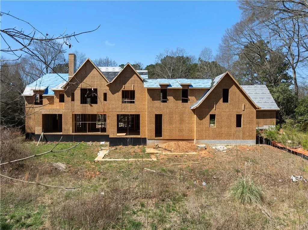 Back of property with a chimney