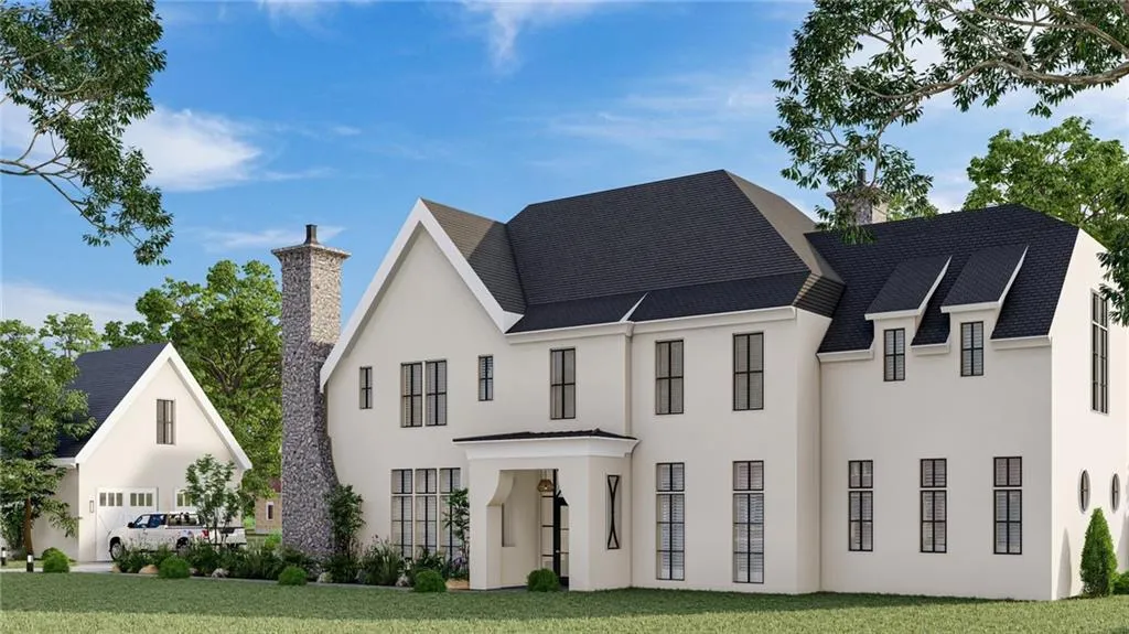 View of front of property with a chimney, a front yard, stucco siding, and roof with shingles
