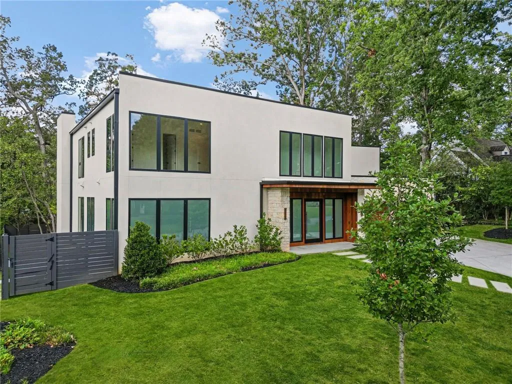Modern architectural design with a flat roofline and large black-framed windows