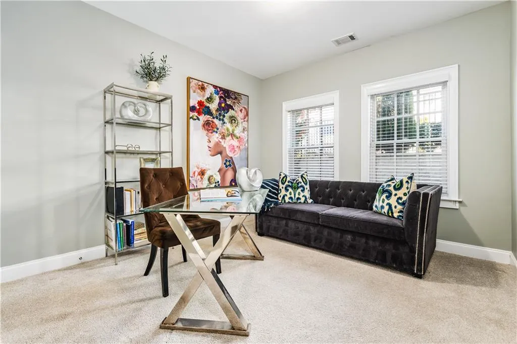 Office featuring carpet, visible vents, and baseboards
