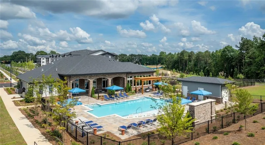 Community pool with a patio area