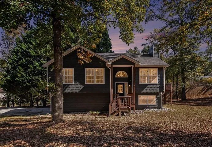 Split foyer home featuring a chimney