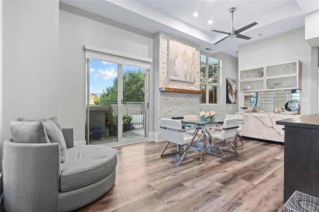 Dining area next to the wet bar and stone fireplace