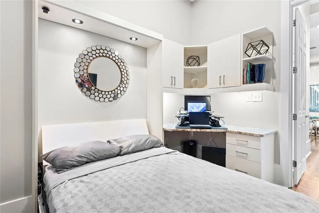 Secondary bedroom has built in office space and Murphy bed
