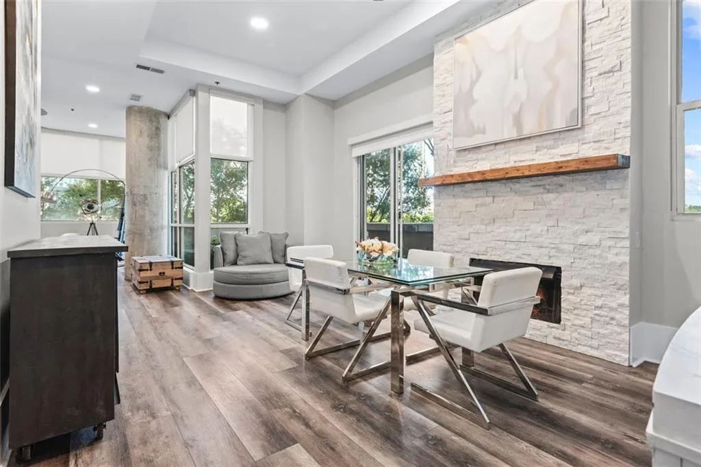 Stacked stone fireplace in dining area