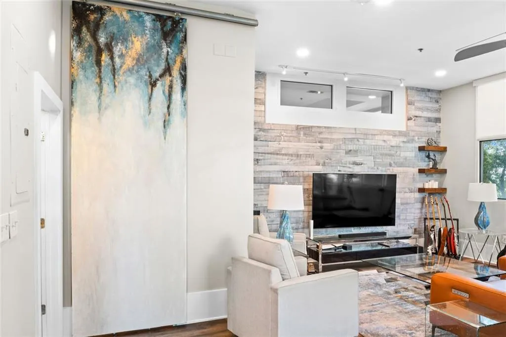 Sliding door separates the owners suite from the living room