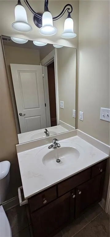 Bathroom featuring vanity and tile patterned floors
