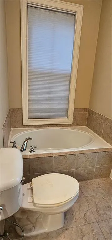 Bathroom deep soaking tub to relax in.