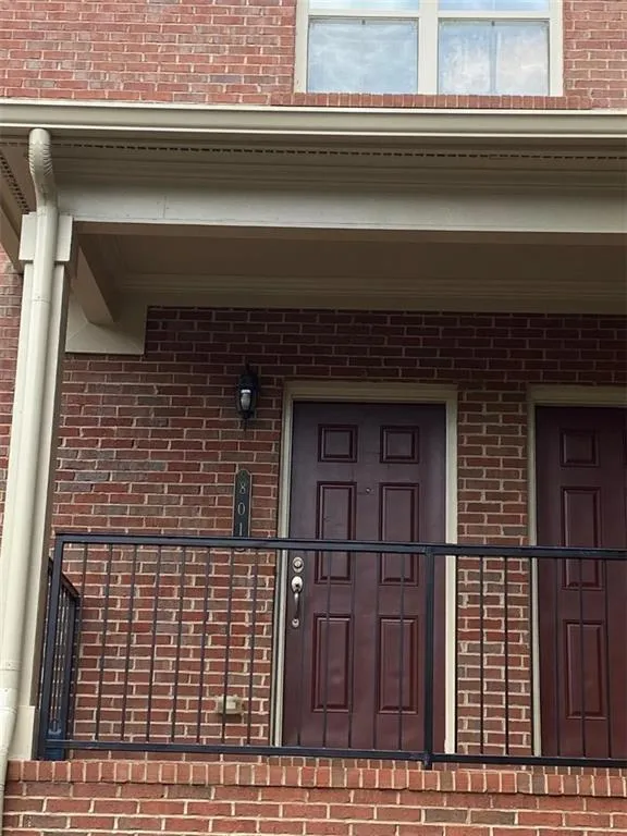 Entrance to property with brick siding