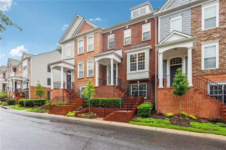 Brick exterior with covered front entryways, bay windows, and dormer windows