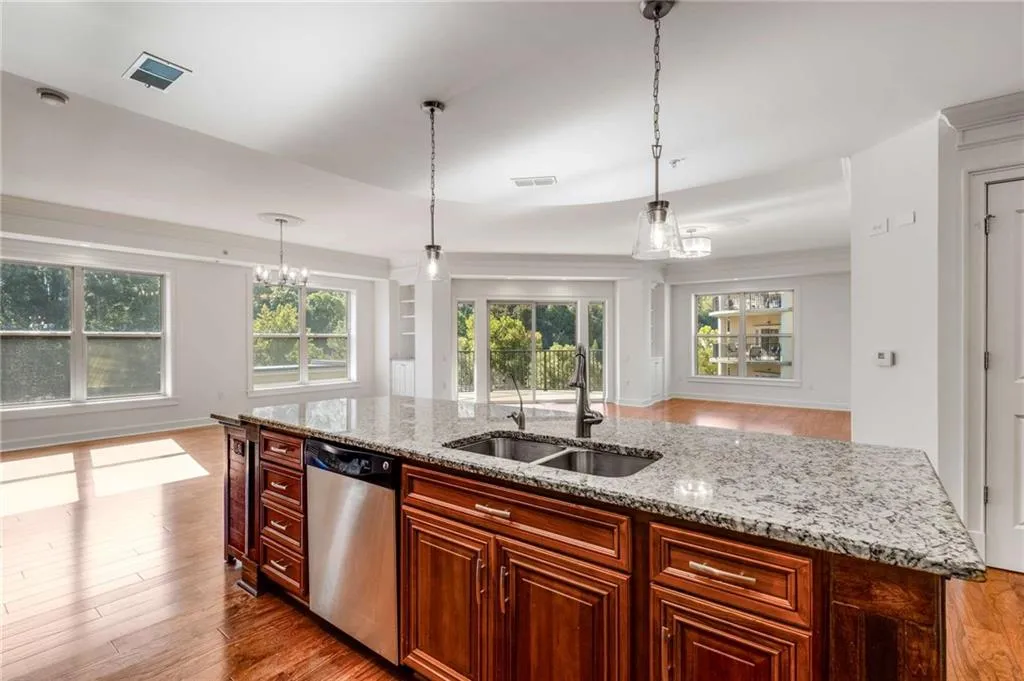Kitchen features a large island with ample seating for at least 5+ bar stools.  Brand new pendant lighting in brushed chrome match the other 2 new lighting fixtures in this space.
