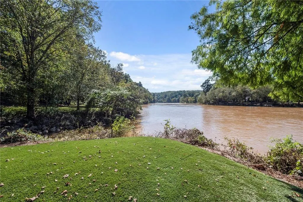 The community also sits along the banks of the Chattahoochee River! You are about 1/2 mile from the entrance of Cochran Shoals and it's all accessible via sidewalks and bike paths! You can even launch your kayak, canoe or float directly from the property!
