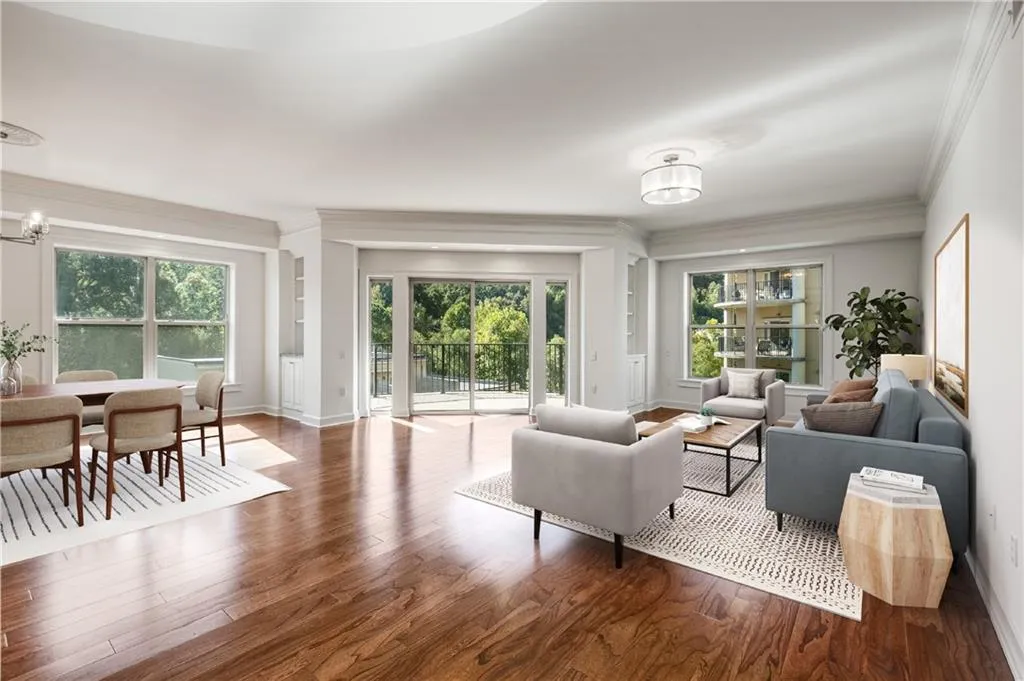 This unit is sun filled with all the windows in the main living area.  Freshly painted walls are neutral and ready for the next owner to customize this space.  Notice the lovely built in cabinet and glass shelving between the patio door and the dining room!