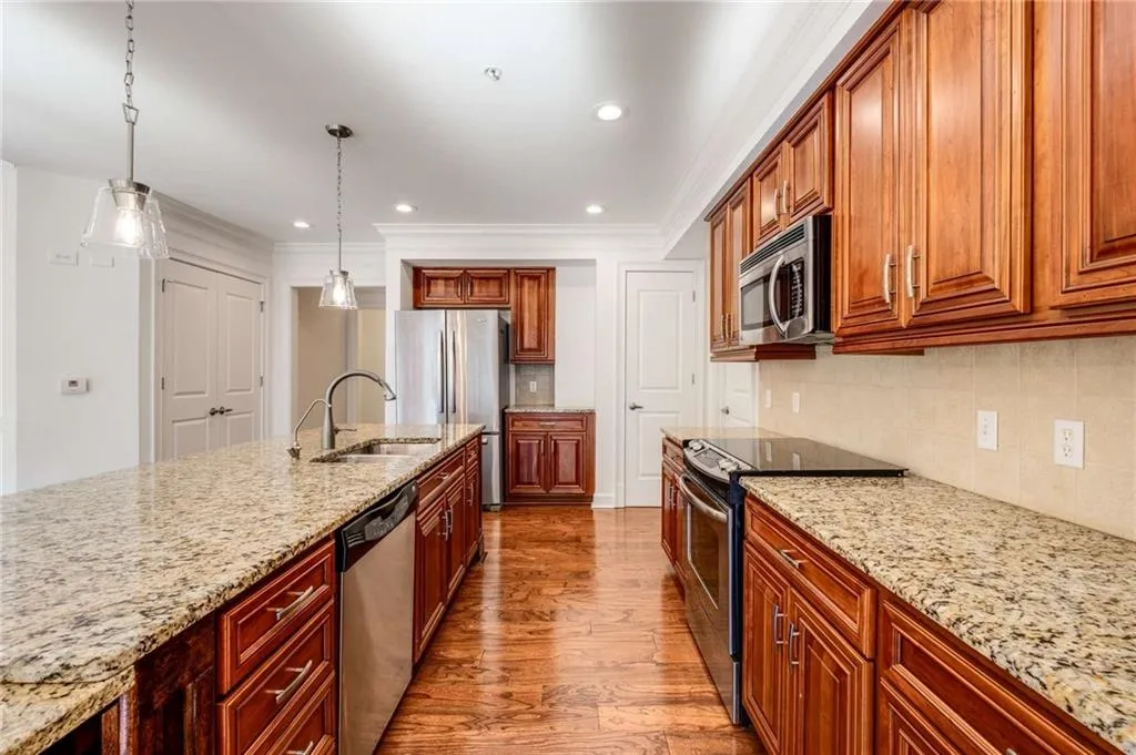 Bottom cabinets have pull outs for ease and accessibility to cooking items.  Look how much countertop space you have!