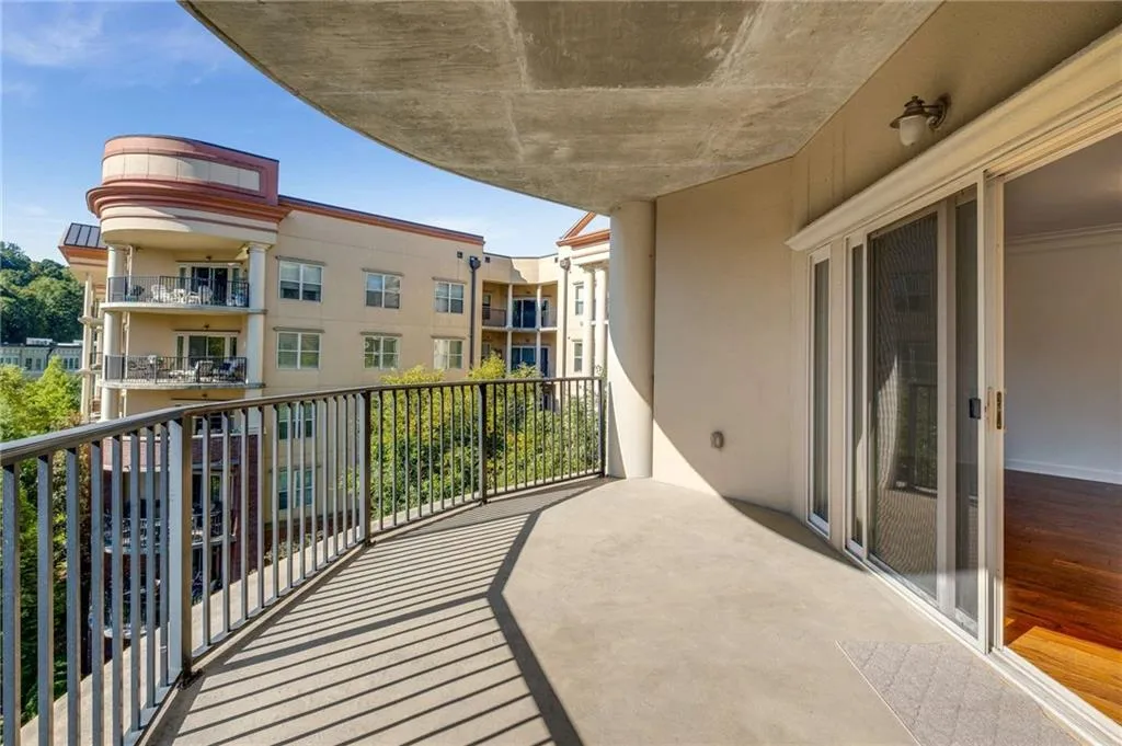 This covered balcony is an extension of your living space.  Plenty of room for a table + chairs and a chaise lounger.