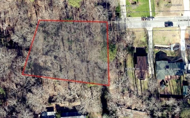 Aerial map of property and surrounding area with property parcel outlined