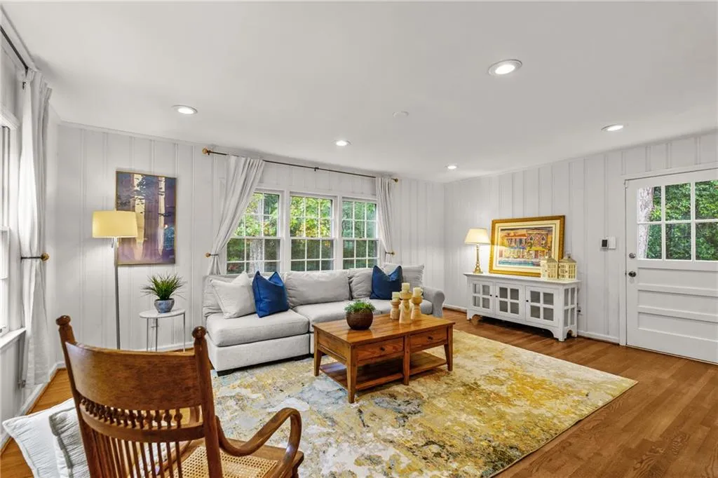 The spacious wood paneled family room exudes warmth and character