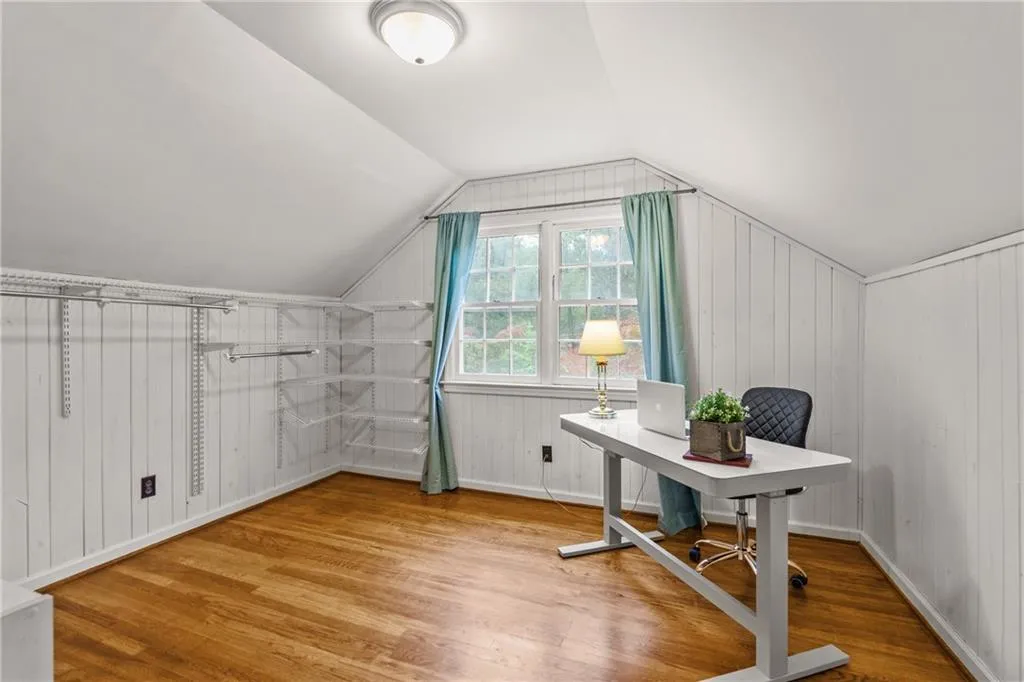 This upper level room can be a bedroom, nursery or dressing room and office.