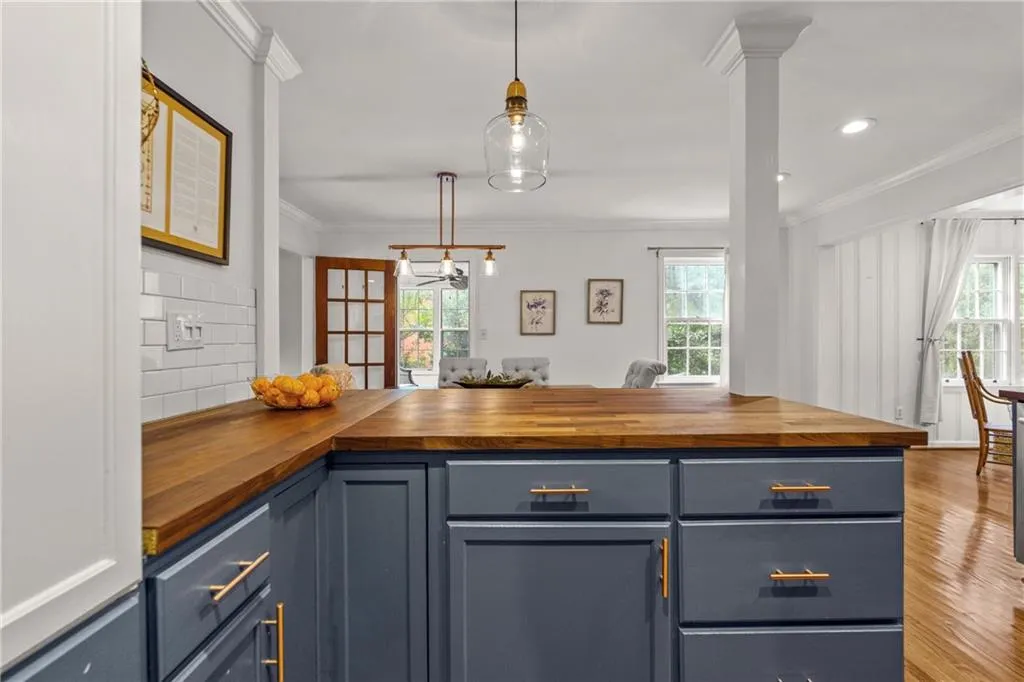 The rich wood countertops bring warmth and charm to this kitchen.