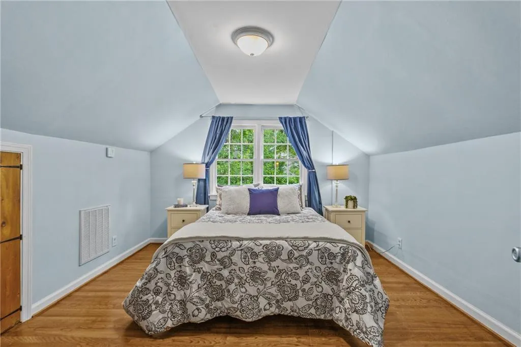 Versatile upper level can serve as the primary suite, home office, or an additional bedroom- complete with a beautifully renovated bathroom